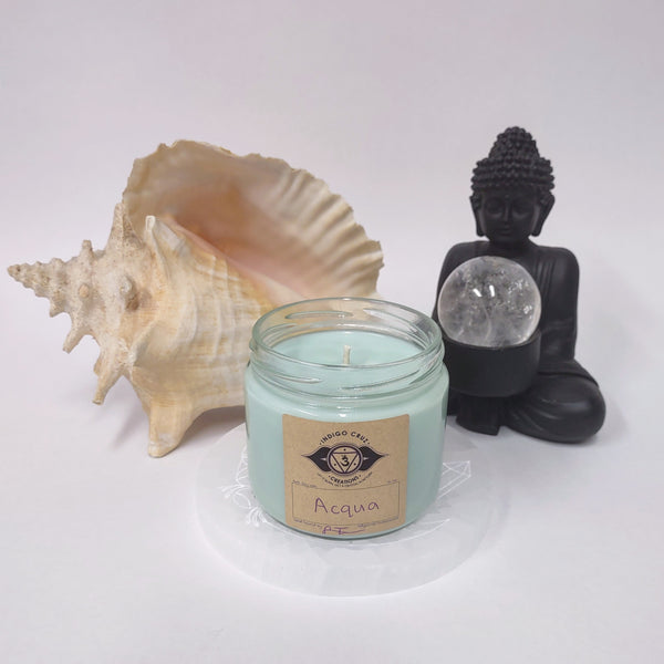 Acqua 10oz soy wax candle with a crystal at the bottom