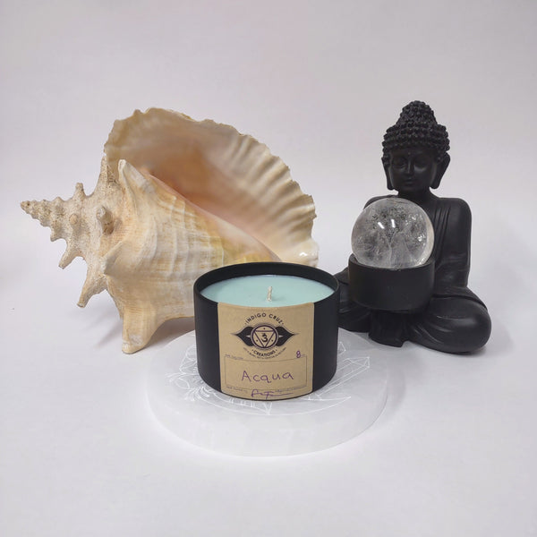 Acqua 8oz soy wax candle with a crystal at the bottom